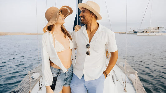 Man and woman on a sailboat with a white background